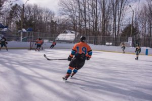 The Mutineers gain control of the puck to move it out of their zone.