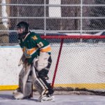 The NMU Club Hockey Goalie getting ready to block a shot.