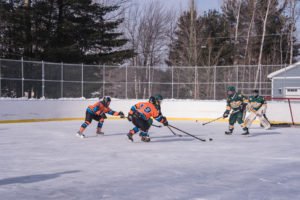 The Wildcats hold on to possession of the puck.