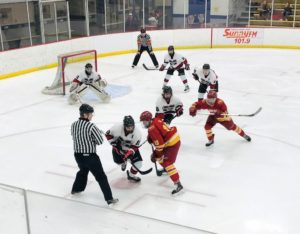 The Marquette Redmen take a face-off in their zone against the Hancock Bulldogs on 103-FXD