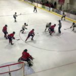 Taking a face-off in the Redmen's zone