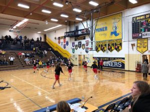 The Redettes warm up ahead of their game against the Negaunee Miners.