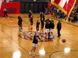 The Eskymos and Redettes warm up side by side.