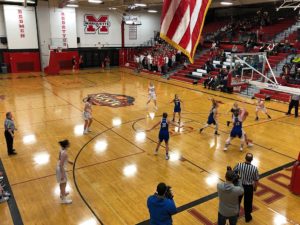 The Redettes drive to the basket.