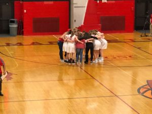 The Redettes huddle up.