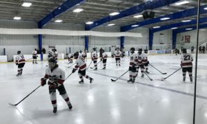 The Redmen warm up ahead of their bout against Birmingham Unified.