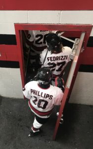 Phillips and Fedrizzi head into the locker room.