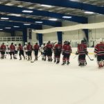 The Redmen congratulate the Rocks on a close victory.