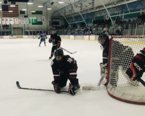 Nick Leafers helps defend the net.