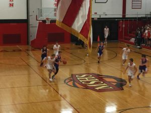 Players sprint down the court.