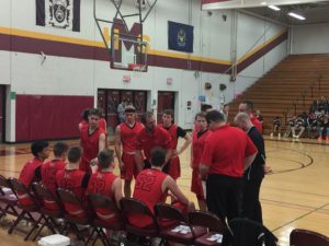The Redmen huddle up.