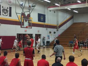 The Redmen go for the lay-up.