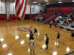 Some action at the Redmen basket.