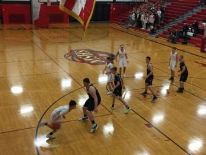 A Redmen drives to the hoop.