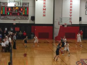 The Redmen defend against the Blue Devils