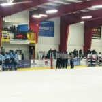 Teams confer with their coaches