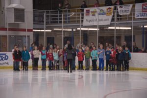 The Sandy Knoll Music Class performing the National Anthem.