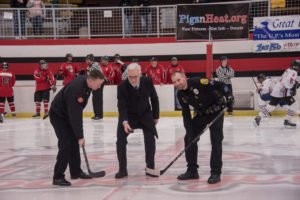 Fire Chief Ian Davis, Marquette City Manager Mike Angeli, and Marquette Police Officer Rob Hansen completing the ceremonial puck drop.