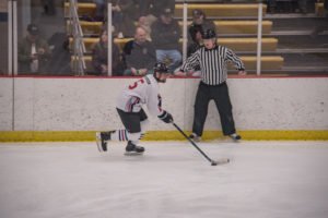 Peterson moves the puck down toward the Heat end zone.