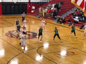 The Redettes make a drive to the basket.