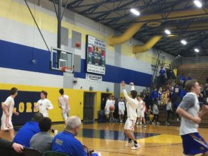 The Marquette Redmen warm up ahead of their regional playoff game against the Midland Chemics.