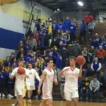 The Redmen finish warming up.