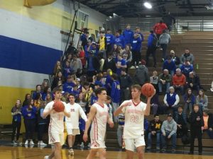 The Redmen finish warming up.