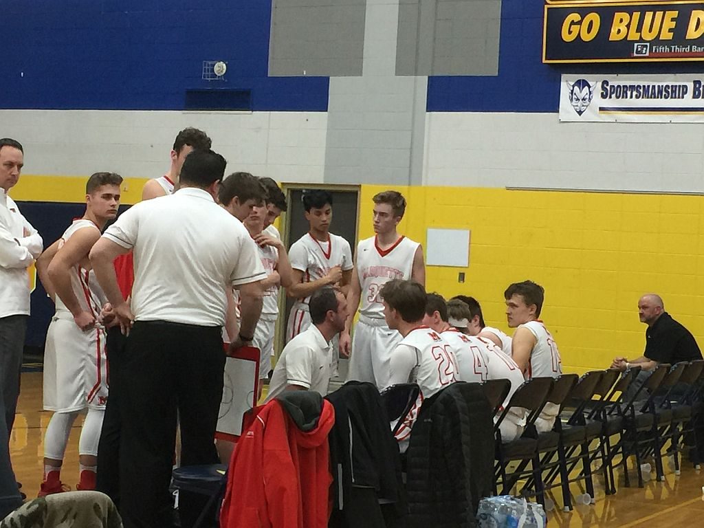 The Redmen huddle up.