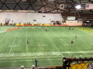 Outfielders prepare for the game in the Superior Dome