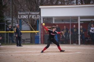 Amanda McIntire winds-up to send the ball to the catcher