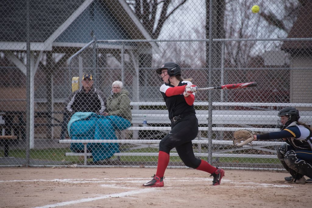 A Redettes batter takes a cut at the ball