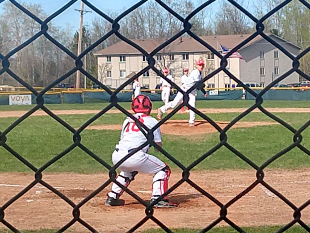 The Redmen finish their warm-ups between innings