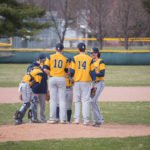 The Negaunee Miners take a break at the mound to focus their defense