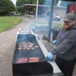 Grillin up some burgers and brats at the Grab-n-Go station.
