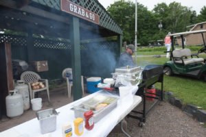 Pick up a burger or brat to eat on the way to the course.