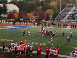 The Redmen punting the ball to the Big Reds