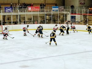 A defensive zone faceoff for the Redmen