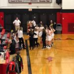 The Redettes during a timeout getting instructions from head coach Ben Smith