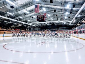The Marquette Redmen lined up for the national anthem before the game