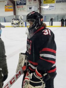 Marquette goalie Carsen Hayes during a stoppage in play