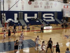 The girls close in on the basket