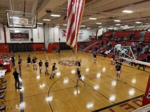 The Redmen warm up for the game.