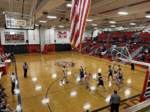 The Redmen drive to the hoop.