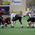 Black team in posession of the ball