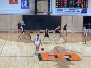 Escnaba taking the ball down court