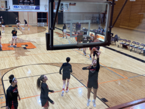 Warm up by the Marquettes Varisty girls team