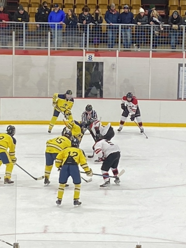 Opening Face-Off between the Miners and Redmen