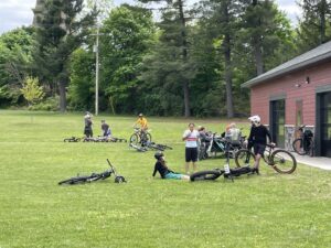 People relaxed on the grass waiting for the race to begin