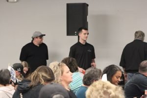 Elijah and Tyler passing out prizes