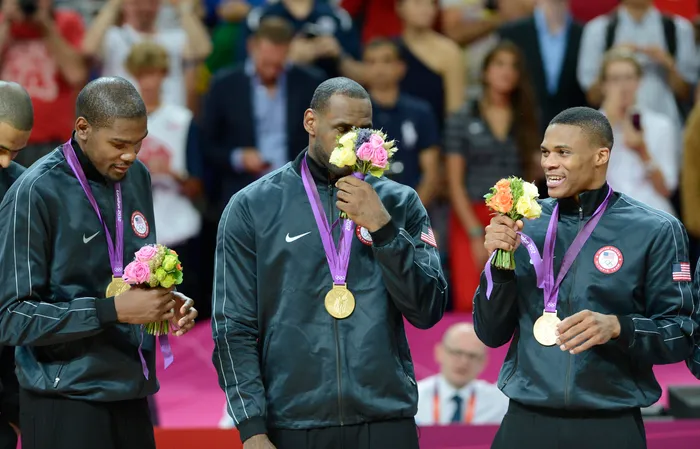 Russell Westbrook Recives his gold metal alongside Lebron James and Kevin Durant
